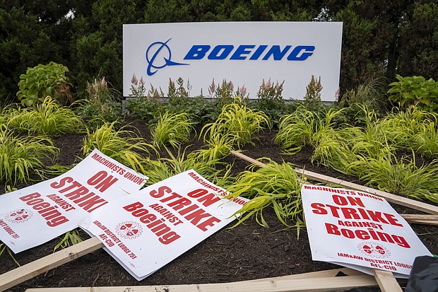 Picket signs outside the Boeing factory in Renton, Washington. The eight-week strike at the company ended when workers voted to accept a new four-year contract at Boeing on November 4.
Mandatory Credit:	M. Scott Brauer/Bloomberg/Getty Images via CNN Newsource