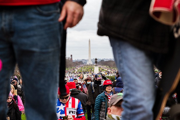 The Washington Monument is seen in the background as pro-Trump protesters break through barriers onto the grounds of the Capitol on January 6, 2021 in Washington, DC.
Mandatory Credit:	Jon Cherry/Getty Images via CNN Newsource