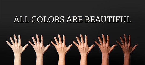Hands of different people and text ALL COLORS ARE BEAUTIFUL on dark background. Stop racism