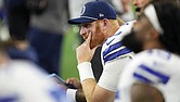 Dallas Cowboys quarterback Cooper Rush sits on the bench Nov. 10 late in the second half of an NFL game against the Philadelphia Eagles in Arlington, Texas.