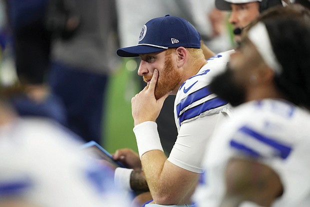 Dallas Cowboys quarterback Cooper Rush sits on the bench Nov. 10 late in the second half of an NFL game against the Philadelphia Eagles in Arlington, Texas.
