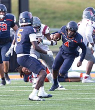 Virginia State University quarterback Romelo Williams calls his own number as the team defeated the Virginia Union Panthers 35-28 on Saturday, Nov. 9, in Ettrick.
