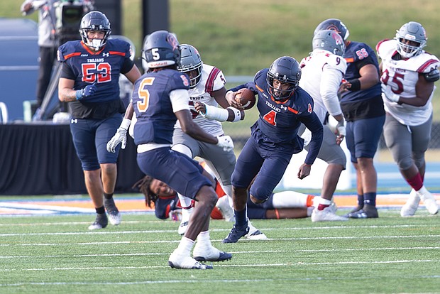 Virginia State University quarterback Romelo Williams calls his own number as the team defeated the Virginia Union Panthers 35-28 on Saturday, Nov. 9, in Ettrick.