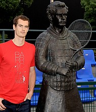 Andy Murray poses alongside his terracotta sculpture.
Mandatory Credit:	Matthew Stockman/Getty Images via CNN Newsource