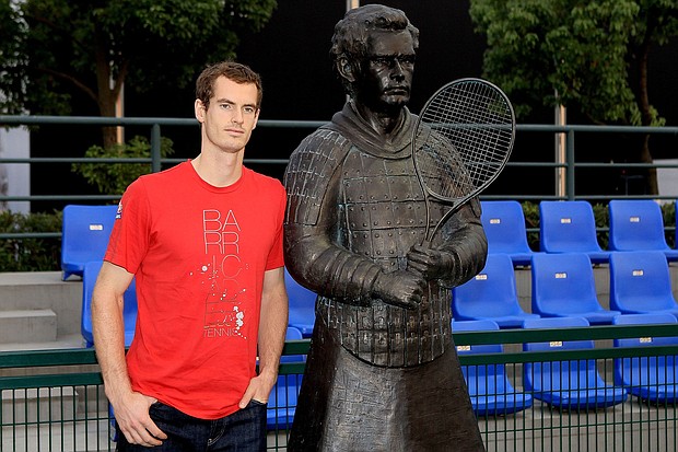Andy Murray poses alongside his terracotta sculpture.
Mandatory Credit:	Matthew Stockman/Getty Images via CNN Newsource