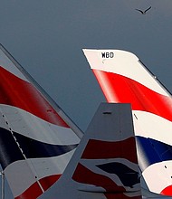Sunlight illuminates the tailfins of British Airways aircraft at Terminal 5 of London Heathrow Airport on February 5, 2021.
Mandatory Credit:	Adrian Dennis/AFP/Getty Images/File via CNN Newsource