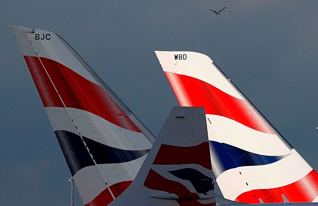 Sunlight illuminates the tailfins of British Airways aircraft at Terminal 5 of London Heathrow Airport on February 5, 2021.
Mandatory Credit:	Adrian Dennis/AFP/Getty Images/File via CNN Newsource