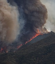 ire burned through the foothills of the San Bernardino Mountains in California, forcing evacuations for neighborhoods in early September.
Mandatory Credit:	Apu Gomes/Getty Images via CNN Newsource