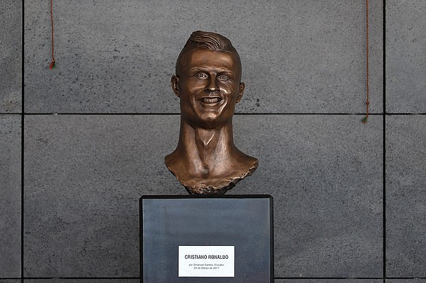A bust of soccer star Cristiano Ronaldo at Madeira Airport that was unveiled in 2017 is often referenced when it comes to controversial sporting sculptures.
Mandatory Credit:	Octavio Passos/Getty Images via CNN Newsource