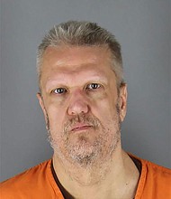 John Sawchak, 54, had two outstanding warrants against him for an alleged yearlong campaign of harassment targeting the shooting victim as well as a third warrant charging him with assaulting another neighbor in 2022, according to court documents.
Mandatory Credit:	Hennepin County Sheriff's Office via CNN Newsource