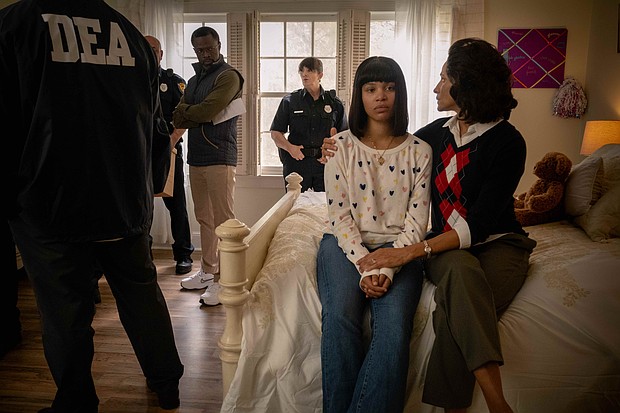 A still from the film “Kemba” depicts the  moment a young Kemba Smith faces law enforcement at her family’s home, highlighting the emotional and legal challenges of her story. The film will be screened on Nov. 21 at 6 p.m. in the Claude G. Perkins Living and Learning Center at Virginia Union University.