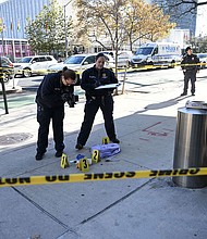 Officers of New York Police Department (NYPD) investigate the site where the suspect of 3 knife attacks that killed 2 was captured and taken into custody at East 46th Street and First Avenue.
Mandatory Credit:	Faith Aktas/Anadolu/Getty Images via CNN Newsource