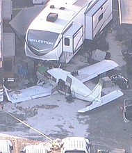 Four people were injured when a single-engine plane crashed Sunday morning at the In-N-Out Burger Pomona Dragstrip.
Mandatory Credit:	KABC via CNN Newsource