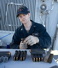 241115-N-DM318-1049 PACIFIC OCEAN (Nov. 15, 2024) Fire Controlman 1st Class Blake Harris, from Magnolia, Texas loads 9mm magazines prior to a small arms gun shoot during routine operations aboard the Arleigh Burke-class guided-missile destroyer USS Milius (DDG 69), in the Pacific Ocean, Nov. 15, 2024. Milius is forward-deployed and assigned to Destroyer Squadron (DESRON) 15, the Navy's largest DESRON and the U.S. 7th Fleet's principal surface force. (U.S. Navy photo by Mass Communication Specialist 2nd Class Ange Olivier Clement)
