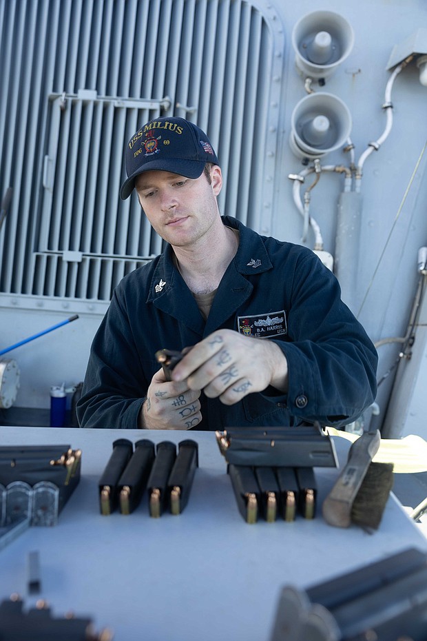 241115-N-DM318-1049 PACIFIC OCEAN (Nov. 15, 2024) Fire Controlman 1st Class Blake Harris, from Magnolia, Texas loads 9mm magazines prior to a small arms gun shoot during routine operations aboard the Arleigh Burke-class guided-missile destroyer USS Milius (DDG 69), in the Pacific Ocean, Nov. 15, 2024. Milius is forward-deployed and assigned to Destroyer Squadron (DESRON) 15, the Navy's largest DESRON and the U.S. 7th Fleet's principal surface force. (U.S. Navy photo by Mass Communication Specialist 2nd Class Ange Olivier Clement)