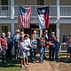 Anderson Mayor Marc Benton, center, helps cut the ribbon on Fanthorp Inn State Historic Site on Friday, Nov. 15, in Anderson. (Patrick Hughey | Texas Historical Commission)