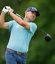 American golfer Brian Harman plays his shot from the 18th tee during the third round of the Memorial Tournament at Muirfield Village Golf Club in June. Harman said on November 19 that a woman is in a coma after trying to save his son from drowning in October.
Mandatory Credit:	Dylan Buell/Getty Images via CNN Newsource