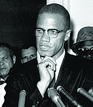 Malcolm X speaks to reporters, May 16, 1963, in Washington, D.C.