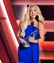 Megan Moroney was awarded the new artist of the year trophy at the CMA Awards on November 20.
Mandatory Credit:	George Walker IV/Invision/AP via CNN Newsource