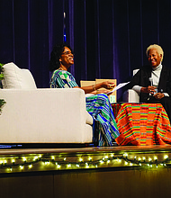 Paula D. Royster, left, and Sandra Brownlee discuss the results of an exploration into Brownlee’s lineage last Saturday at Martin Luther King Jr. Middle School. Brownlee was one of several Richmond area residents whose ancestry was researched as part of “Reclaiming Our Time,”,an ongoing project to reveal the histories and DNA ancestry of participants, with a major focus on Richmond’s public housing communities.
The event also included a three-person drum circle and ceremonial weddings for ancestors whose marriages went unrecognized by law.