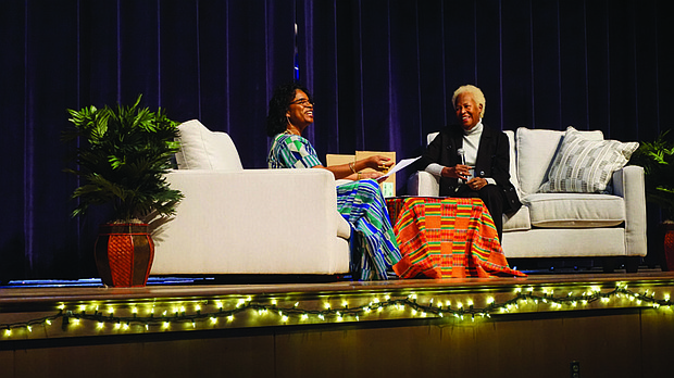 Paula D. Royster, left, and Sandra Brownlee discuss the results of an exploration into Brownlee’s lineage last Saturday at Martin Luther King Jr. Middle School. Brownlee was one of several Richmond area residents whose ancestry was researched as part of “Reclaiming Our Time,”,an ongoing project to reveal the histories and DNA ancestry of participants, with a major focus on Richmond’s public housing communities.
The event also included a three-person drum circle and ceremonial weddings for ancestors whose marriages went unrecognized by law.