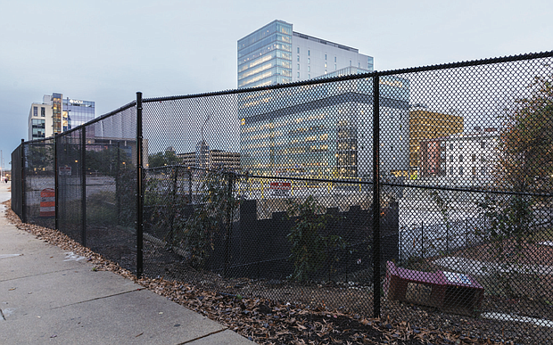 An empty lot at 500 N. 10th St., the site of the former Richmond Public Safety Building, remains after a scrapped multimillion-dollar redevelopment project. City officials are seeking mediation with VCU Health over the failed development and associated financial obligations.