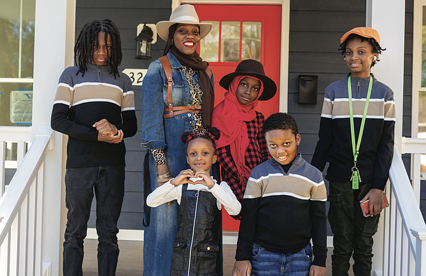 Najiyyah Abdullah and her family stand on the porch of their new home, built through Richmond Habitat for Humanity’s Women Build program. The house, dedicated on Nov. 12, marks Richmond Habitat’s 394th home.