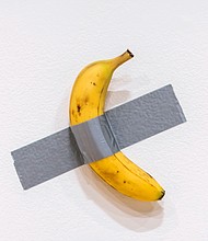 Italian artist Maurizio Cattelan's "Comedian," a conceptual artwork comprising a banana stuck to a wall with duct tape, sold on November 20 for $6.24 million at a Sotheby's auction in New York.
Mandatory Credit:	Eduardo Munoz Alvarez/AP via CNN Newsource