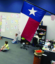 A Texas flag is displayed December 2020 in an elementary school in Murphy, Texas.