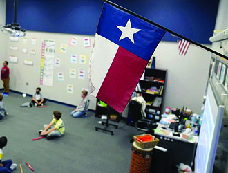 A Texas flag is displayed December 2020 in an elementary school in Murphy, Texas.