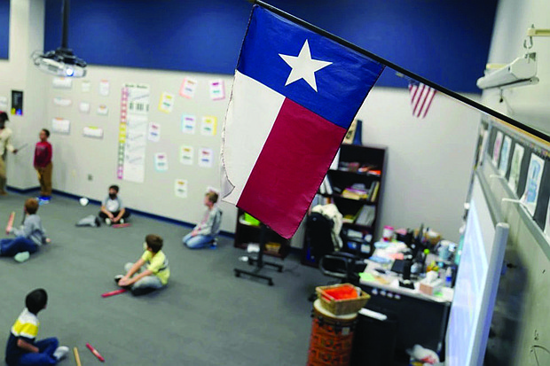 A Texas flag is displayed December 2020 in an elementary school in Murphy, Texas.