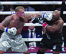 Jake Paul lands a left on Mike Tyson during their heavyweight boxing match, Friday, Nov. 15, in Arlington, Texas.