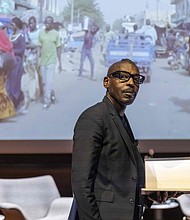 Architect Mario Gooden speaks during the Nov. 15 panel discussion, "Black Architecture: Critical Perspectives on Black Spatial Thinking," at the ICA at VCU. The event, part of the "Dear Mazie" exhibition, explored the legacy and future of Black architecture.  Julianne Tripp Hillian/Richmond Free Press