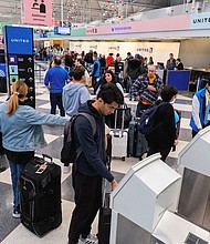 People check in for flights ahead of the Thanksgiving holiday at O’Hare International Airport in Chicago in 2023.
Mandatory Credit:	Vincent Alban/Reuters/FILE via CNN Newsource