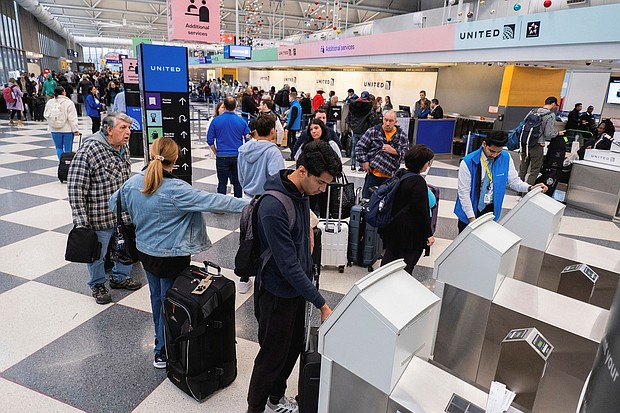 People check in for flights ahead of the Thanksgiving holiday at O’Hare International Airport in Chicago in 2023.
Mandatory Credit:	Vincent Alban/Reuters/FILE via CNN Newsource