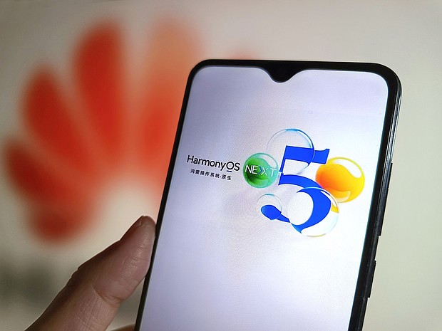 Huawei's HarmonyOS NEXT operating system is displayed on a smartphone screen with a Huawei logo in the background.
Mandatory Credit:	VCG/Getty Images via CNN Newsource