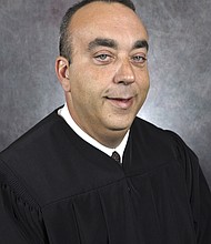 Video shown in court last month showed the fatal shooting of District Judge Kevin Mullins inside his chambers.
Mandatory Credit:	Kentucky Court of Justice/AP/File via CNN Newsource