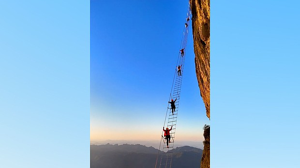 Travelers climbing the "sky ladder."
Mandatory Credit:	Courtesy Qixing Adventure via CNN Newsource