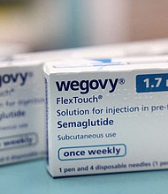 Boxes of Wegovy are seen at a pharmacy.
Mandatory Credit:	Hollie Adams/Reuters/File via CNN Newsource