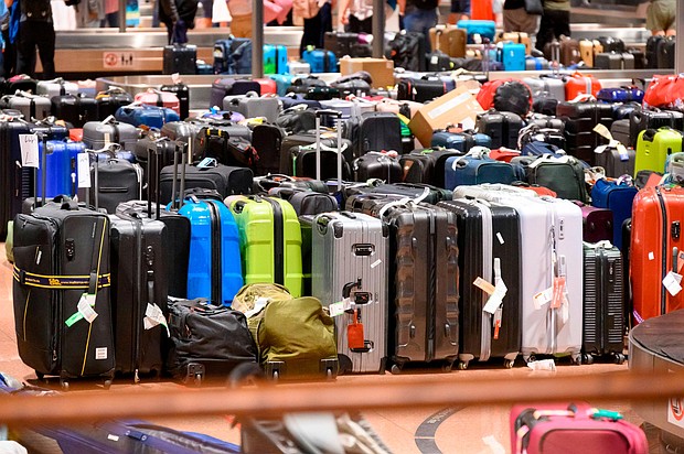 Hundred of suitcases, bags and baby carriages are stacked up at Hamburg Airport in Germany.
Mandatory Credit:	Jonas Walzberg/picture-alliance/dpa/AP via CNN Newsource
