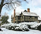 Agecroft Hall, covered in snow, will host its free Yuletides open house on Dec. 8 from noon to 5 p.m. The event features holiday crafts, historic tours, and a visit from Father Christmas.