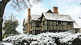 Agecroft Hall, covered in snow, will host its free Yuletides open house on Dec. 8 from noon to 5 p.m. The event features holiday crafts, historic tours, and a visit from Father Christmas.