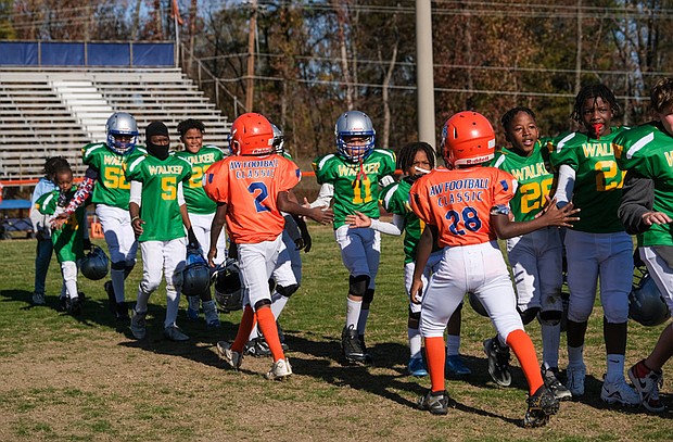 Players at a recent Armstrong Walker Football Classic congratulate each other after a recent game.