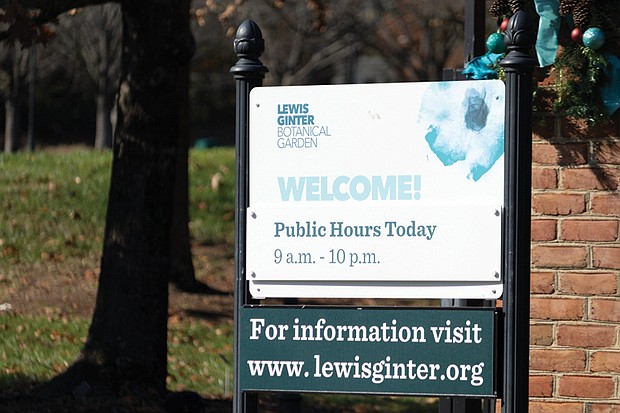 A sign denotes Lewis Ginter Botanical Garden public visiting hours at the entrance on Lakeside Ave last week.