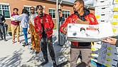 Volunteers from the Kappa Alpha Psi Richmond Alumni Chapter distribute turkeys during the 6th Annual Thanksgiving Turkey Giveaway and Resource Fair at River City Middle School, 6300 Hull Street Rd., on Saturday, Nov. 23. Del. Mike Jones (77th District), supported by Rosie’s Richmond and Churchill Downs Incorporated, provided 2,000 turkeys to Richmond residents.