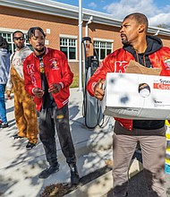 Volunteers from the Kappa Alpha Psi Richmond Alumni Chapter distribute turkeys during the 6th Annual Thanksgiving Turkey Giveaway and Resource Fair at River City Middle School, 6300 Hull Street Rd., on Saturday, Nov. 23. Del. Mike Jones (77th District), supported by Rosie’s Richmond and Churchill Downs Incorporated, provided 2,000 turkeys to Richmond residents.