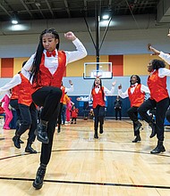 The River City Middle School Step Team performs during the 6th Annual Thanksgiving Turkey Giveaway and Resource Fair.