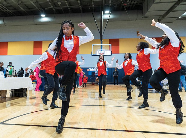 The River City Middle School Step Team performs during the 6th Annual Thanksgiving Turkey Giveaway and Resource Fair.