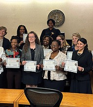 New CASA Advocates, Brenda Winston, Amy Ringberg, Ajanee Ransom, Deshawnda Johnson, Sydney Quinones, Ethel Hayes, Shakia Lane, Suzanne Harrison, Alejandra Lewis, Janet Hanson, and Portia Albrecht, joined by Judge Stacy E. Leen.