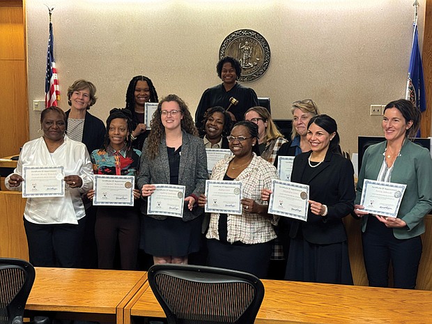New CASA Advocates, Brenda Winston, Amy Ringberg, Ajanee Ransom, Deshawnda Johnson, Sydney Quinones, Ethel Hayes, Shakia Lane, Suzanne Harrison, Alejandra Lewis, Janet Hanson, and Portia Albrecht, joined by Judge Stacy E. Leen.